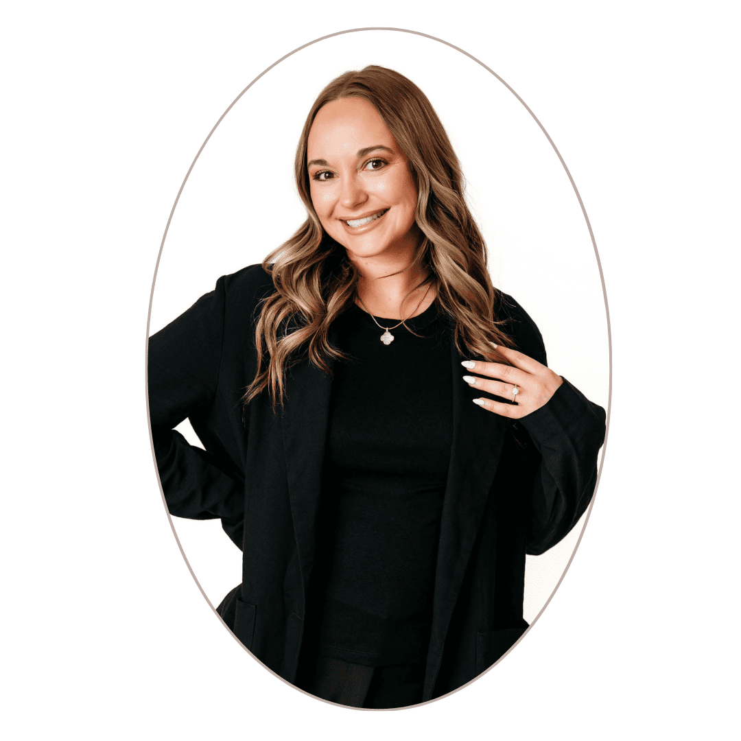 Smiling spa concierge in black blazer portrait